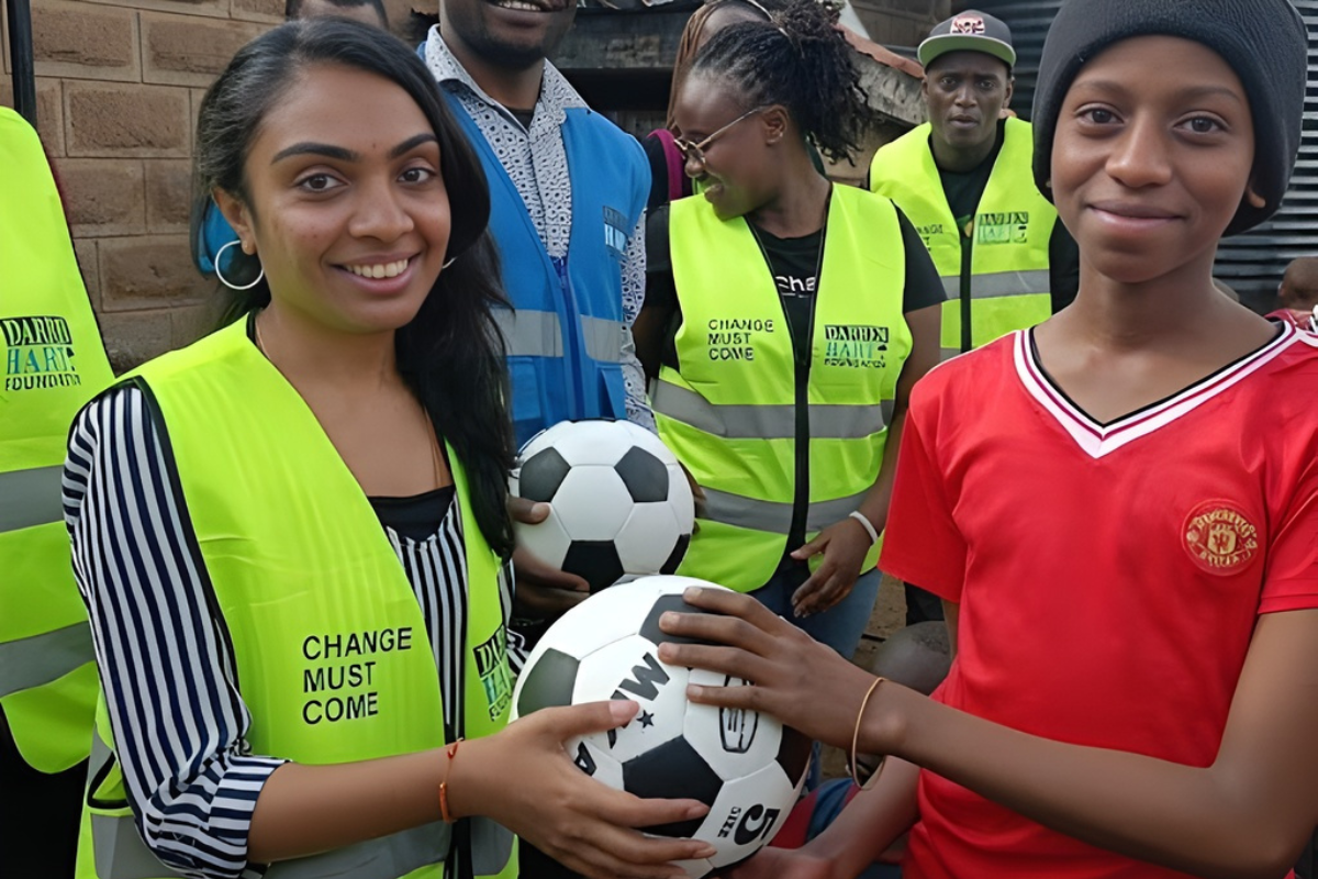 Donating a football to boys because empowerment means inclusion for both girls and boys