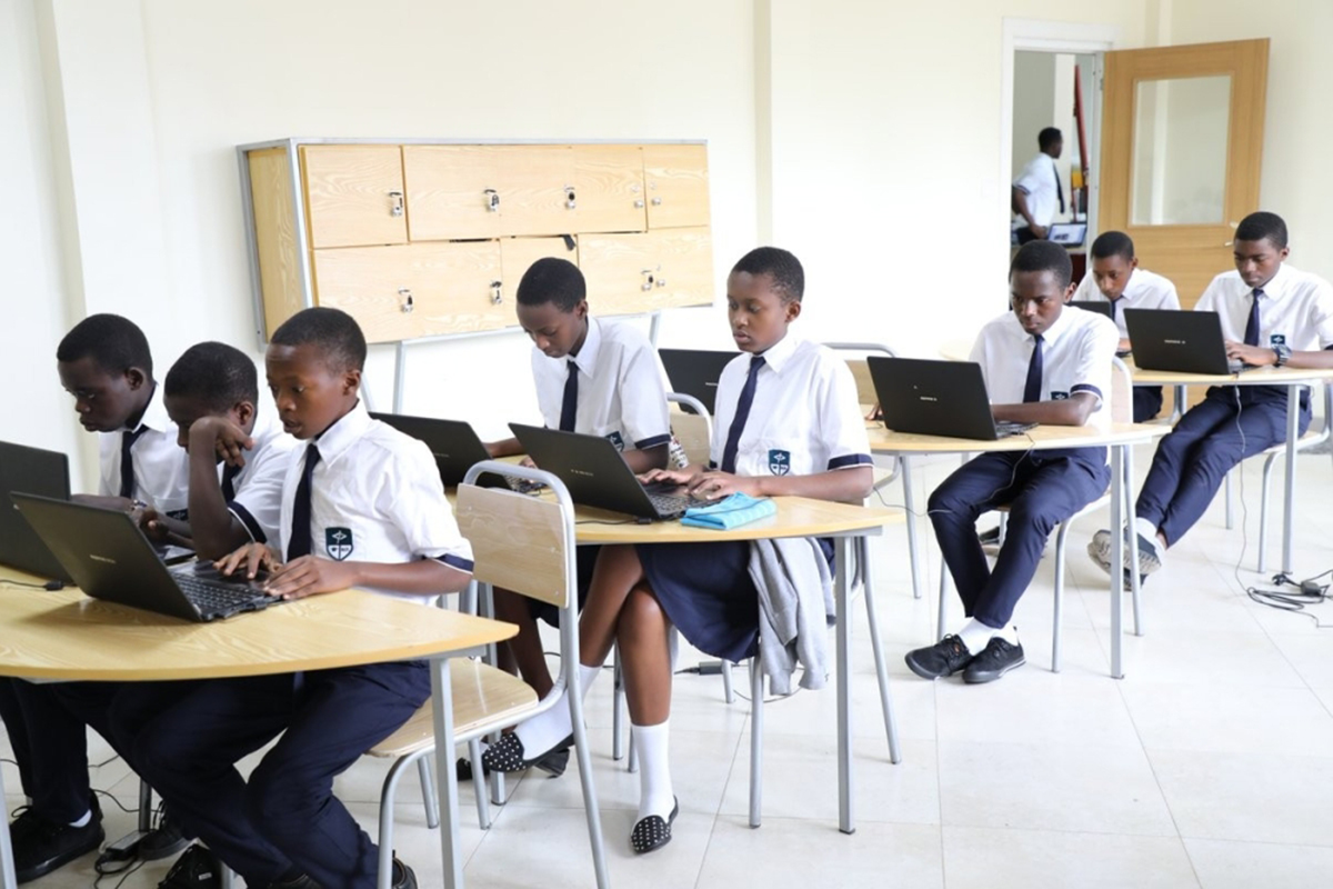 Students working on laptops during a coding class at Rwanda’s new university