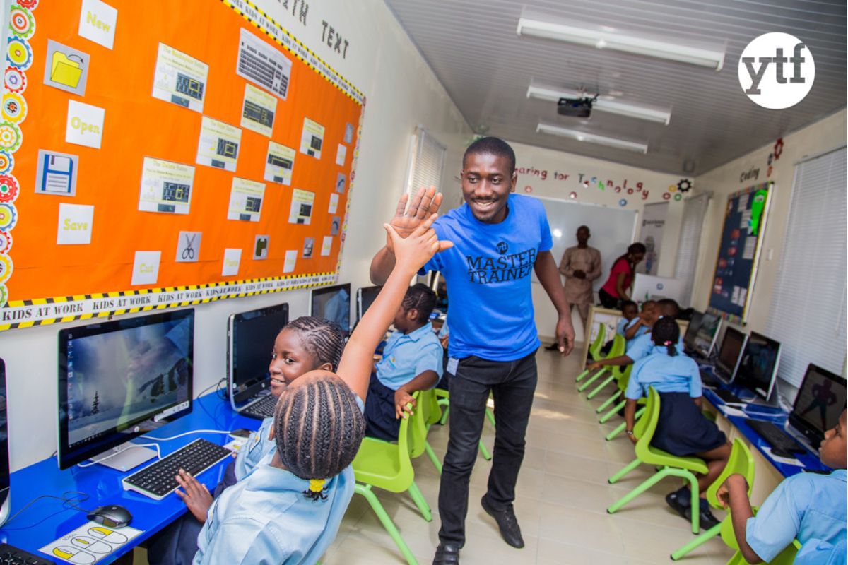 Students practising computer skills on laptops in an Ethiopian school 

