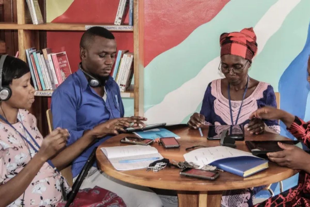 Students in Dakar engaging with AI-powered learning tools in a public school classroom