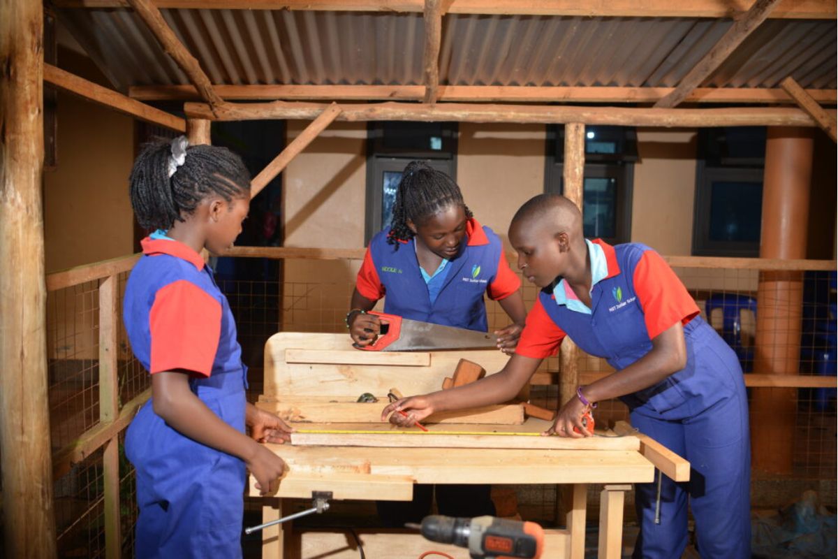 Students learning carpentry at a rural vocational training centre in Uganda