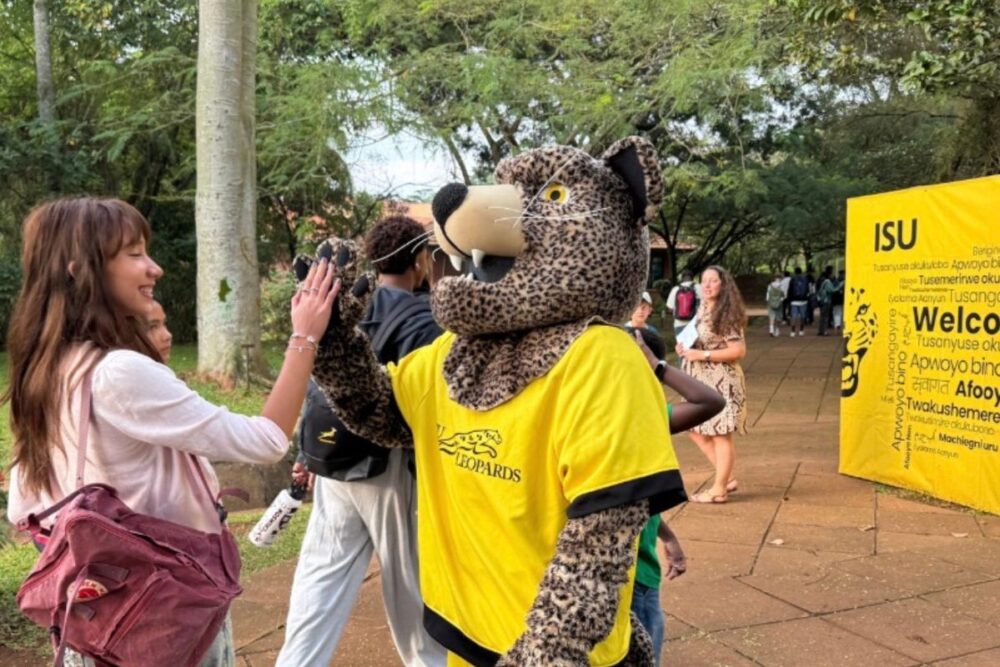 Leopards mascot welcoming parents and students at the International School of Uganda