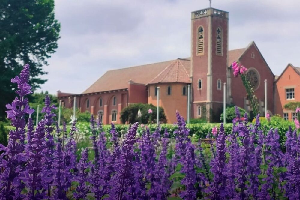 Michaelhouse campus showcasing historic buildings and sports fields
