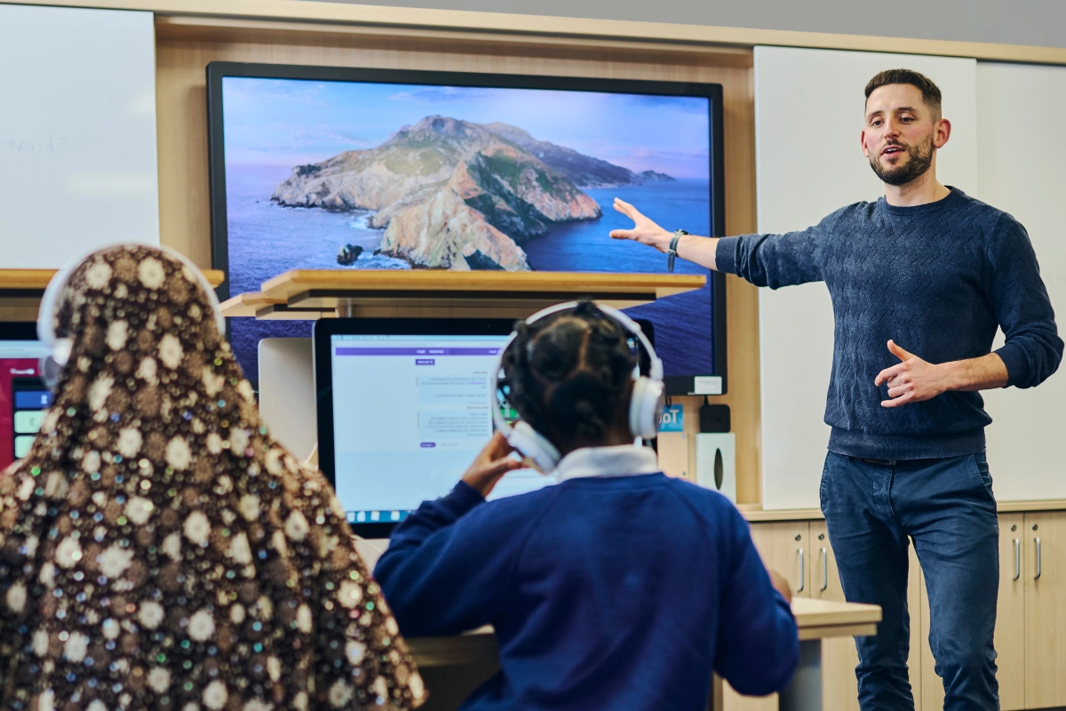 Teachers using curriculum resources during a classroom lesson