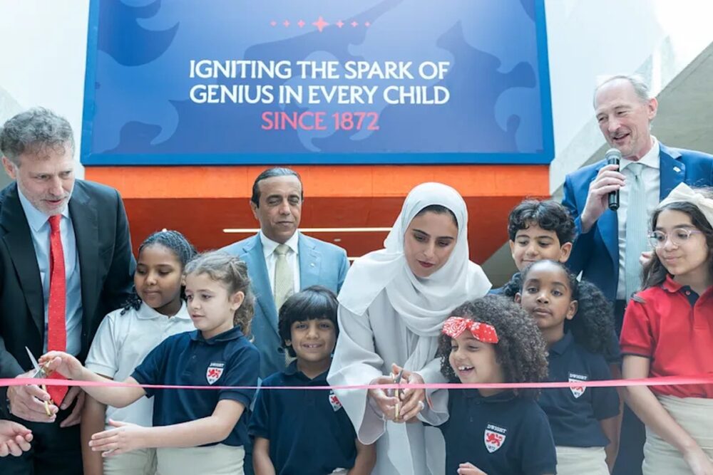 Students and school leaders celebrate the opening of Dwight School Cairo with a ribbon-cutting ceremony. Image via Dwight.edu